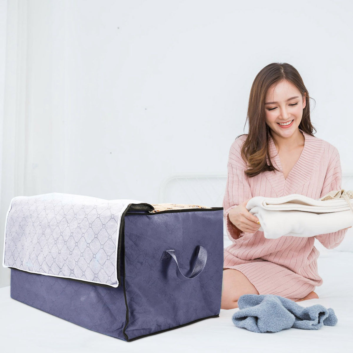Foldable clothes storage bag size reference shot