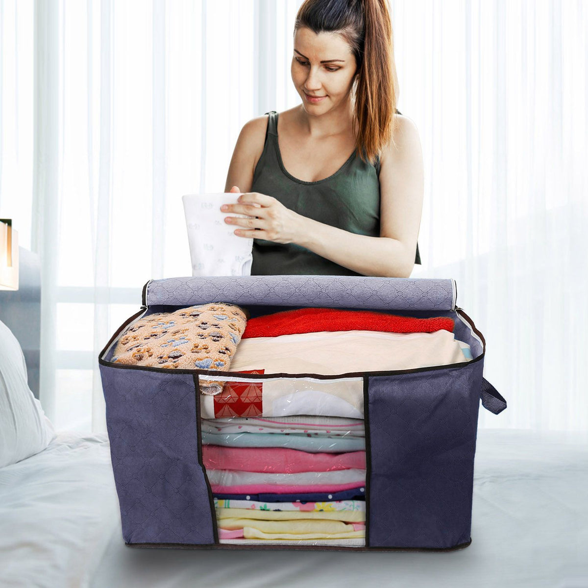 Foldable clothes storage bag size reference shot