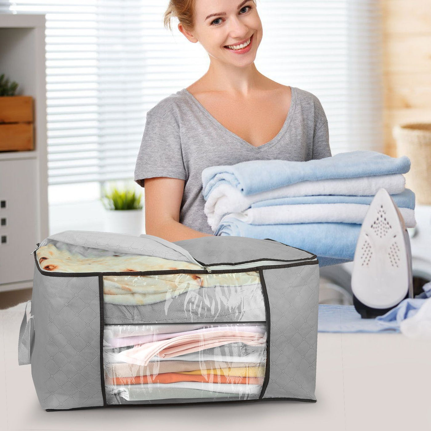 Foldable clothes storage bag shown holding folded garments