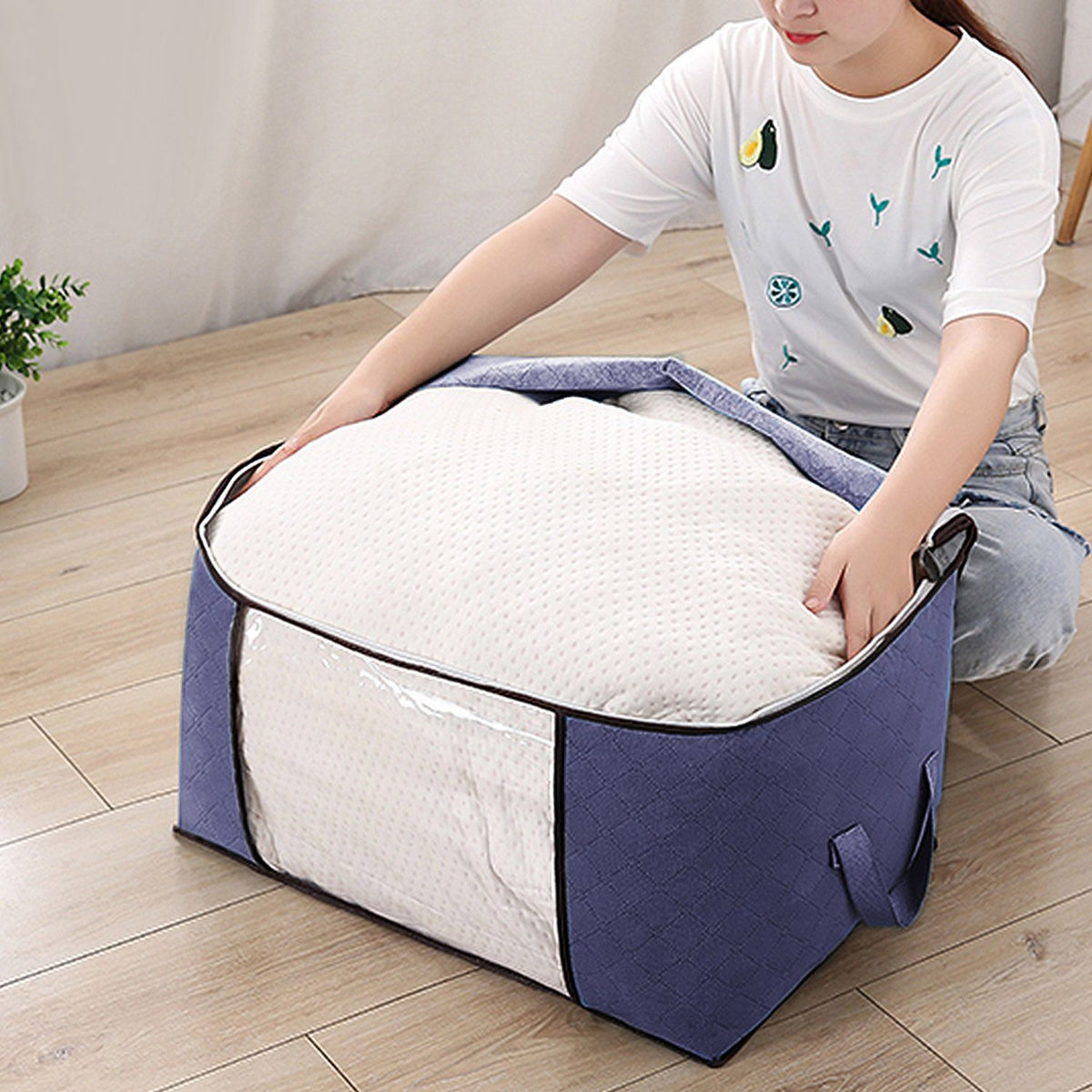 Foldable clothes storage bag size reference shot