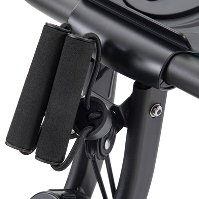 Folding exercise bike shown in recumbent position with backrest