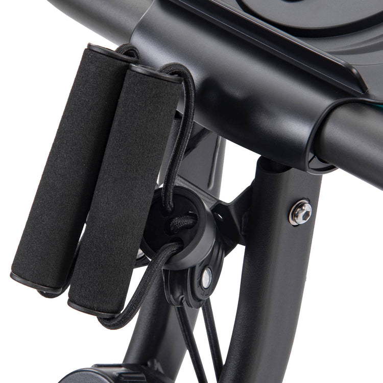 Folding exercise bike shown in recumbent position with backrest