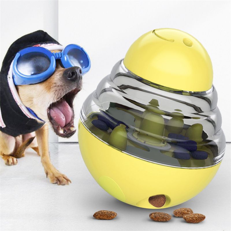 Dog playing with treat dispensing ball