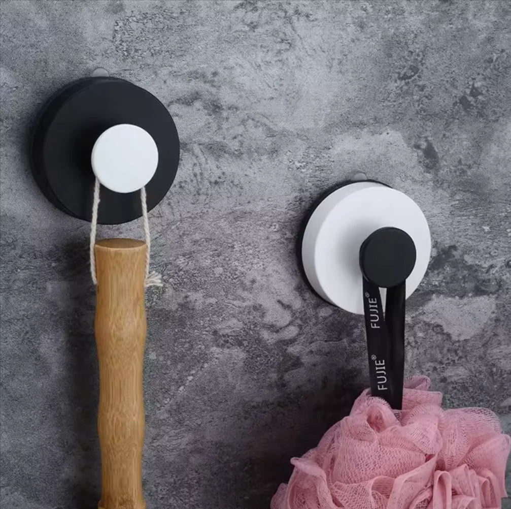 Punch-free vacuum suction cup hook mounted on white bathroom tile