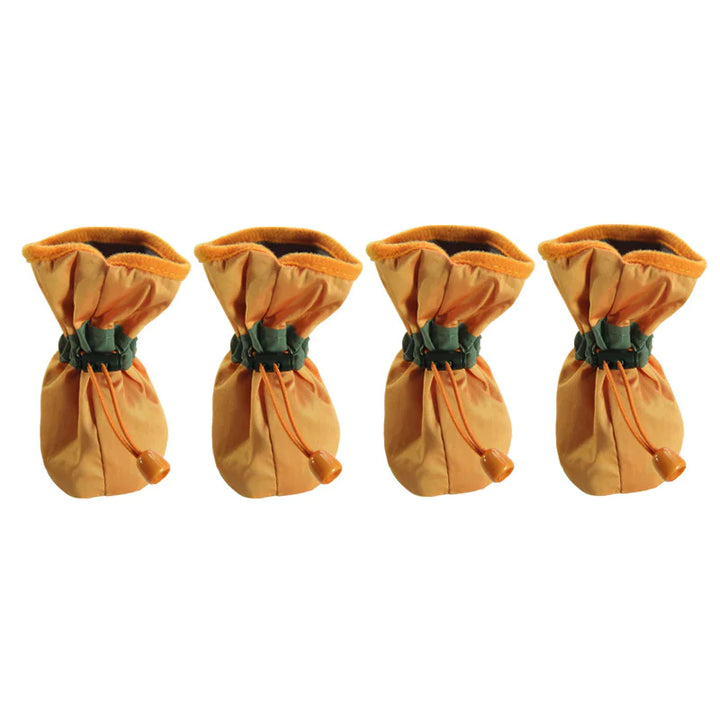 Set of four orange dog boots shown together