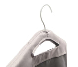 Hanging hamper with dirty clothes inside a bedroom closet