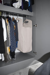 Hanging laundry hamper in a small dorm closet