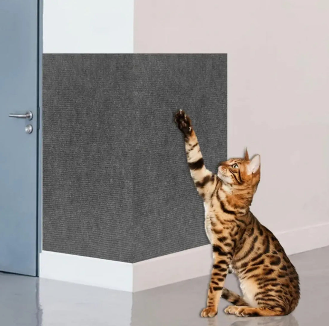 Grey woven sisal cat scratcher panel shaped to wrap around and protect a wall corner