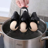 Penguin egg holder with eggs lowered into a pot of water by its handle