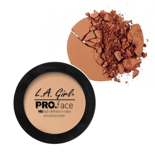 Compact face powder size reference held in a hand