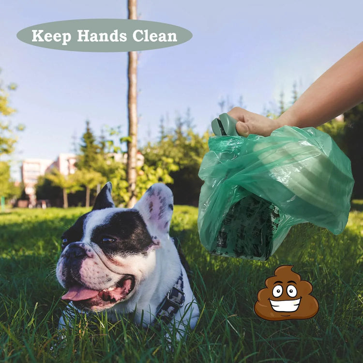 Portable pet waste scoop shown with the jaw open ready to pick up waste