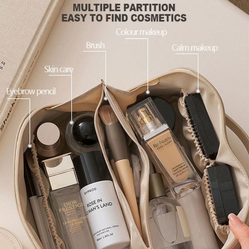 Leather-style travel makeup bag packed inside carry-on