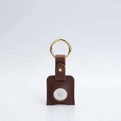 Leather AirTag holder case styled with keys