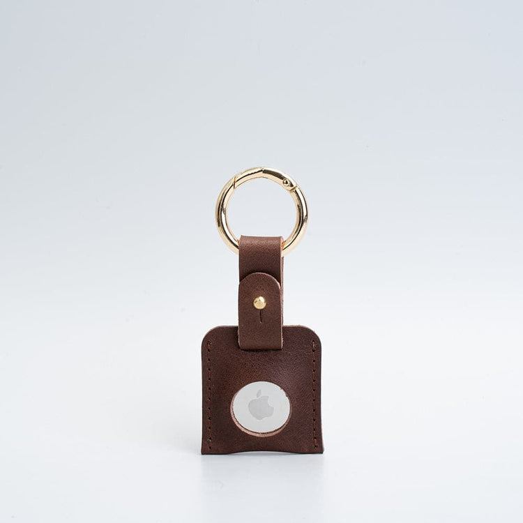 Leather AirTag holder case styled with keys