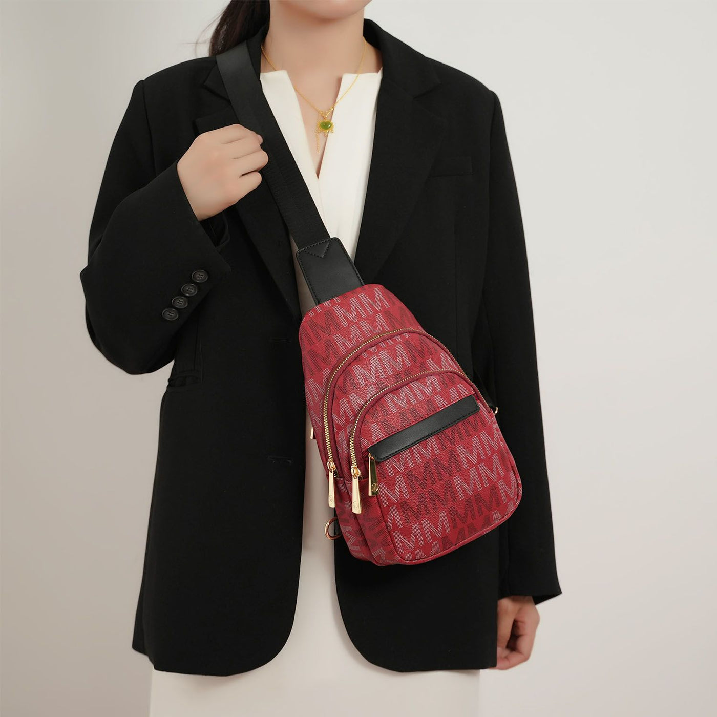 MKF Helaena logo sling bag worn crossbody
