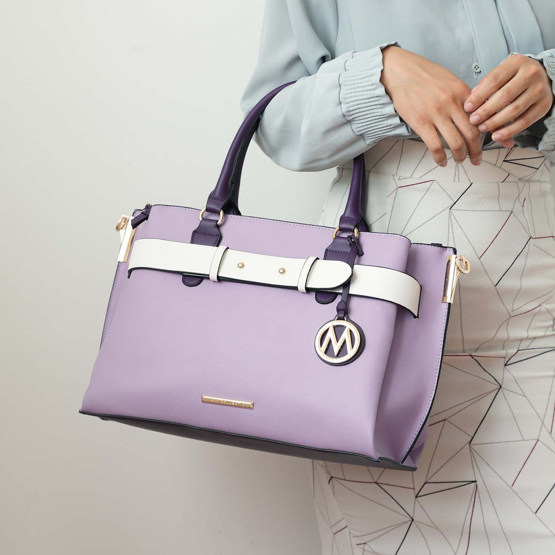 MKF Jamie satchel in neutral color, lifestyle scene