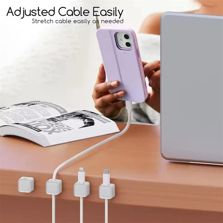 Magnetic cable clips mounted on a desk edge