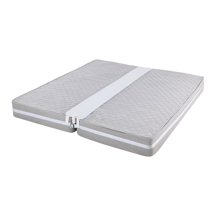 Mattress gap filler shown fitted under a bed sheet