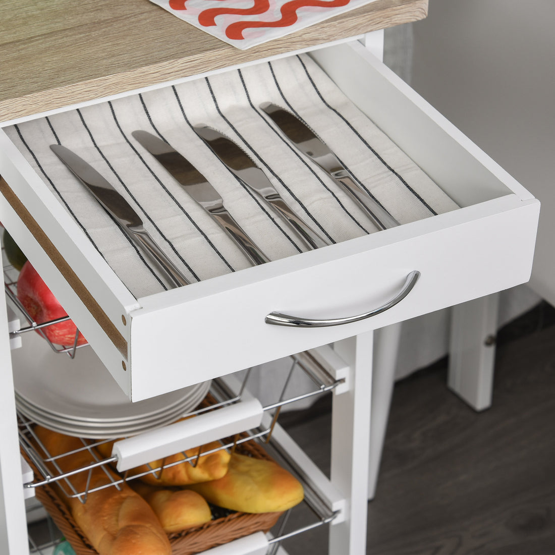 Mobile kitchen cart positioned in an apartment kitchen