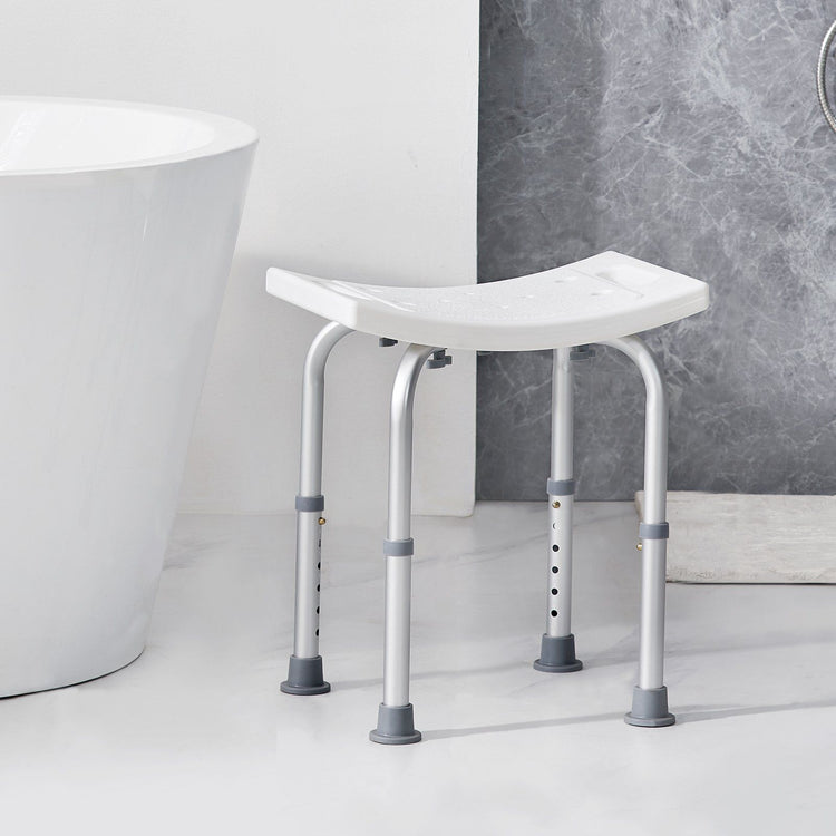 Non-slip adjustable bath stool with side grab handles positioned for stepping in and out of a shower safely