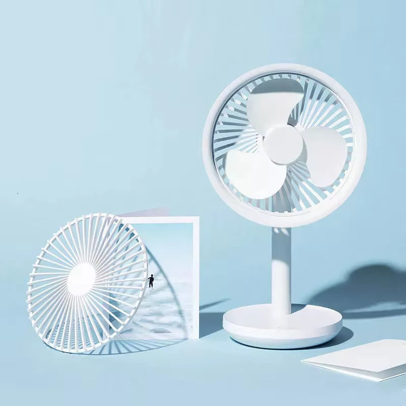 Portable handheld fan placed on a desk