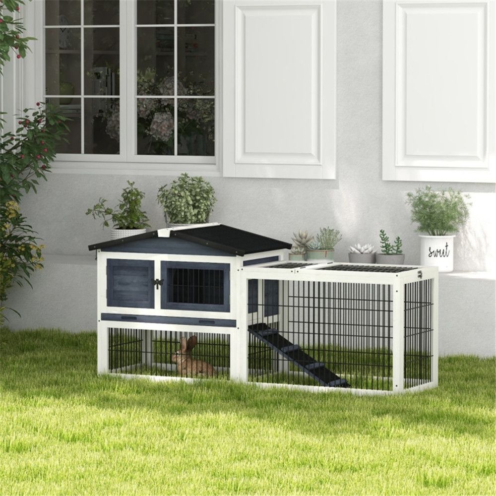Outdoor rabbit hutch in garden setting