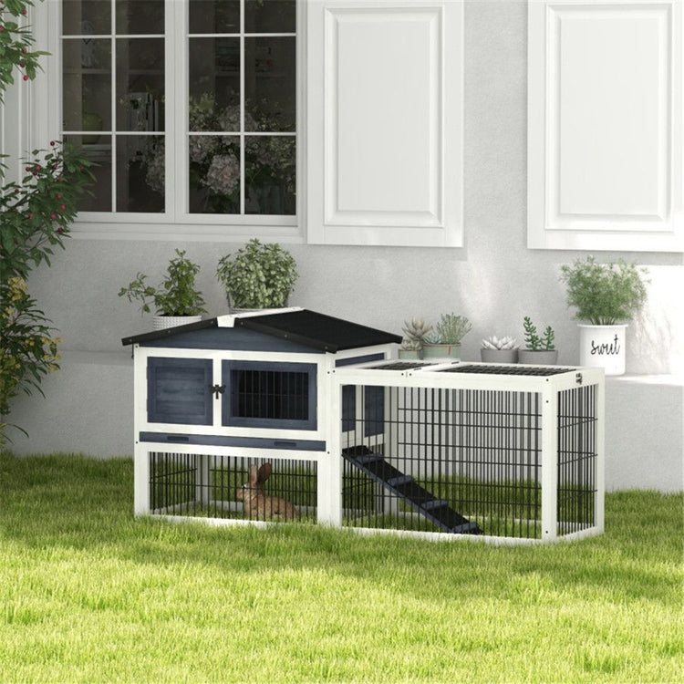 Outdoor rabbit hutch in garden setting