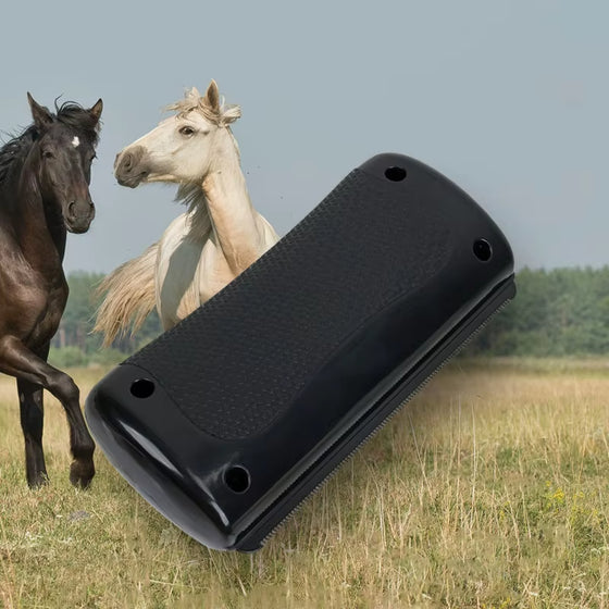 Black handheld pet hair remover with horses grazing behind