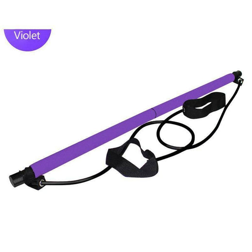 Pilates bar with resistance bands used for leg work