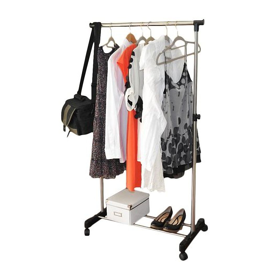 Portable rolling clothes rack used as bedroom overflow closet