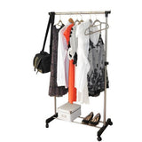 Portable rolling clothes rack used as bedroom overflow closet