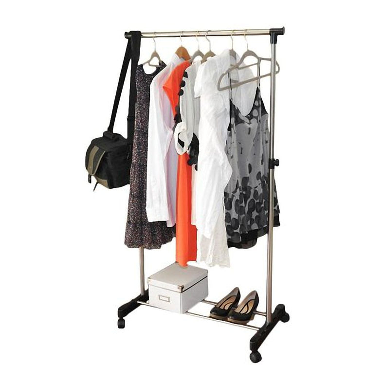 Portable rolling clothes rack used as bedroom overflow closet