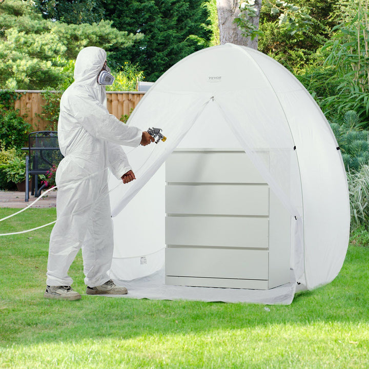 Portable pop-up spray paint booth tent shown expanded with mesh side panels for airflow during furniture refinishing