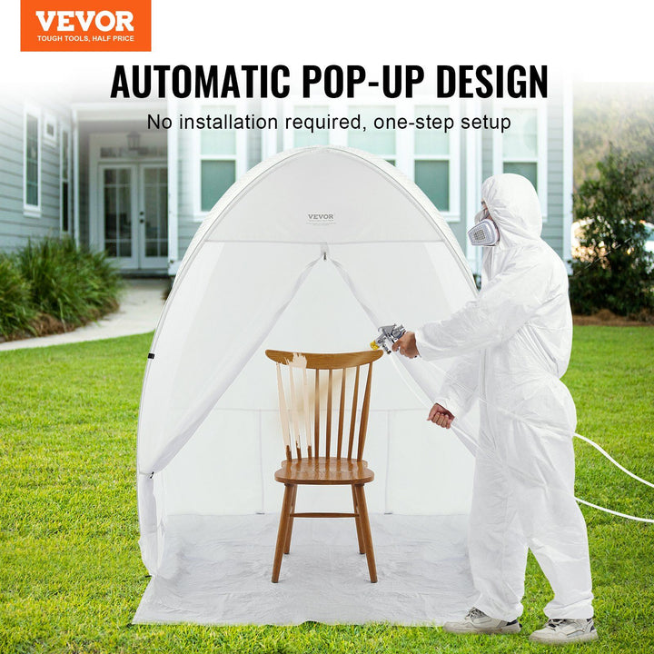 Portable spray paint booth in use with furniture being spray painted inside