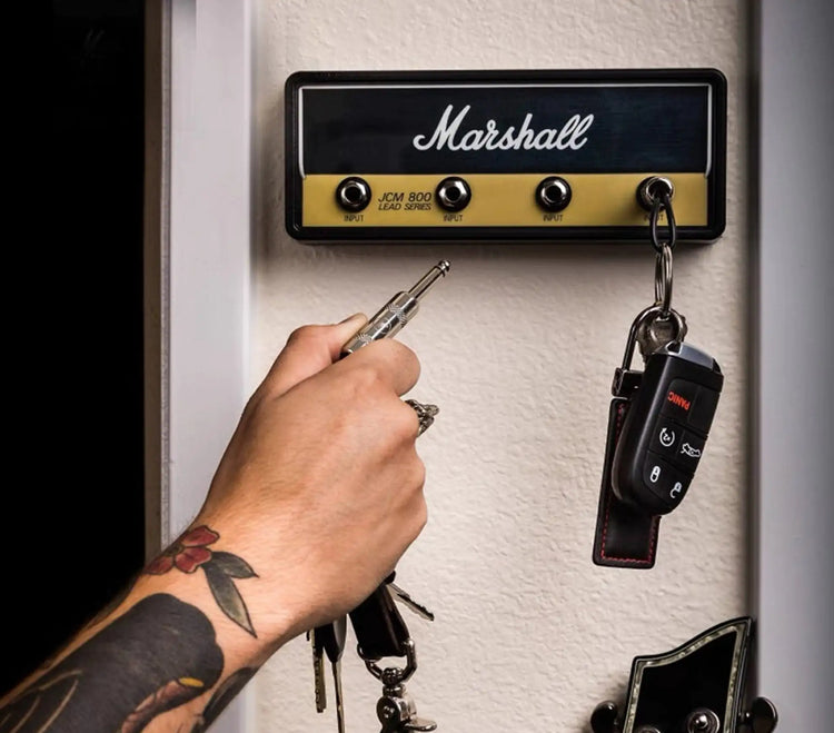 Marshall amplifier-style wall-mounted key holder in black and cream with four jack-socket hooks for hanging keys