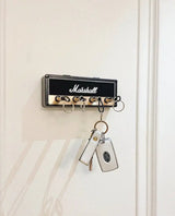 Key holder box shown in the white colorway mounted on a wall
