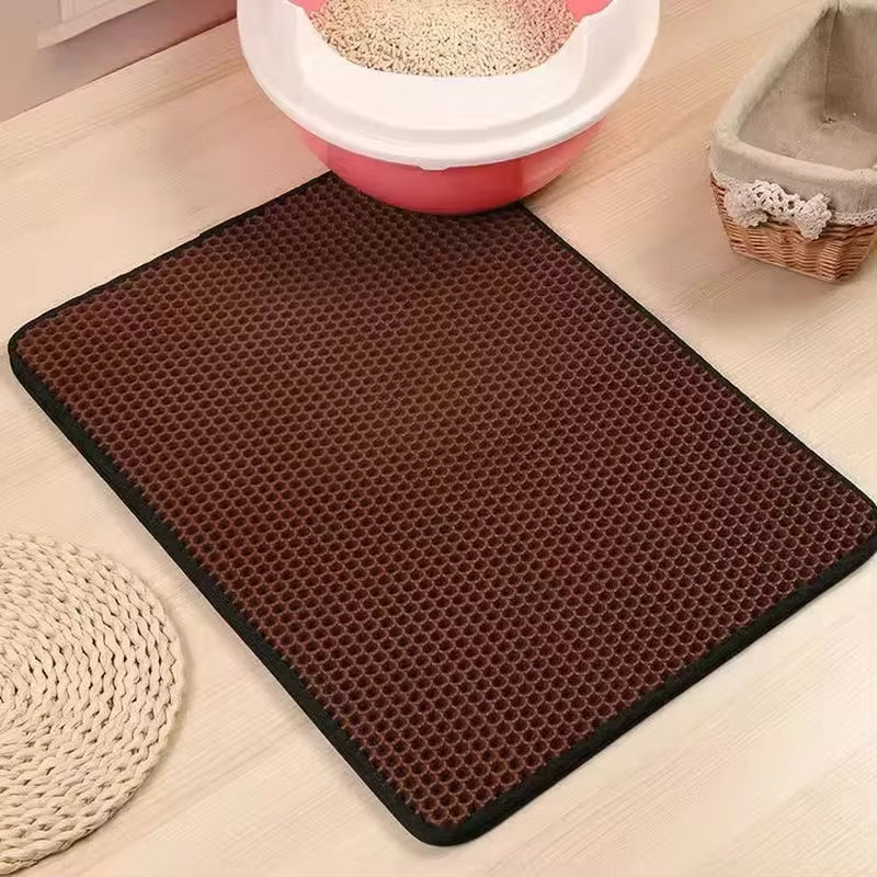 Cat litter mat in khaki color with cat stepping off