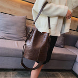 Single shoulder bucket bag shown in alternate colorway