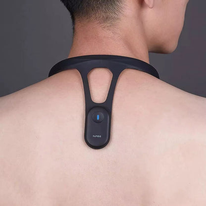 Smart posture trainer fitted on the upper back for alignment cues