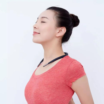 Posture trainer device shown in use during desk work