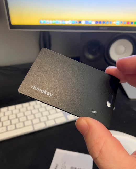 Wallet tracker card placed inside a leather wallet