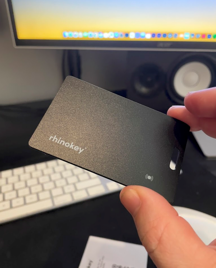 Wallet tracker card placed inside a leather wallet