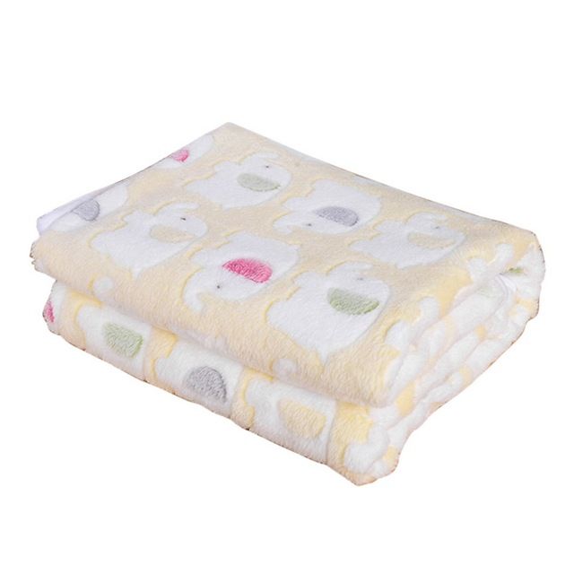 Cat resting on soft fluffy pet blanket