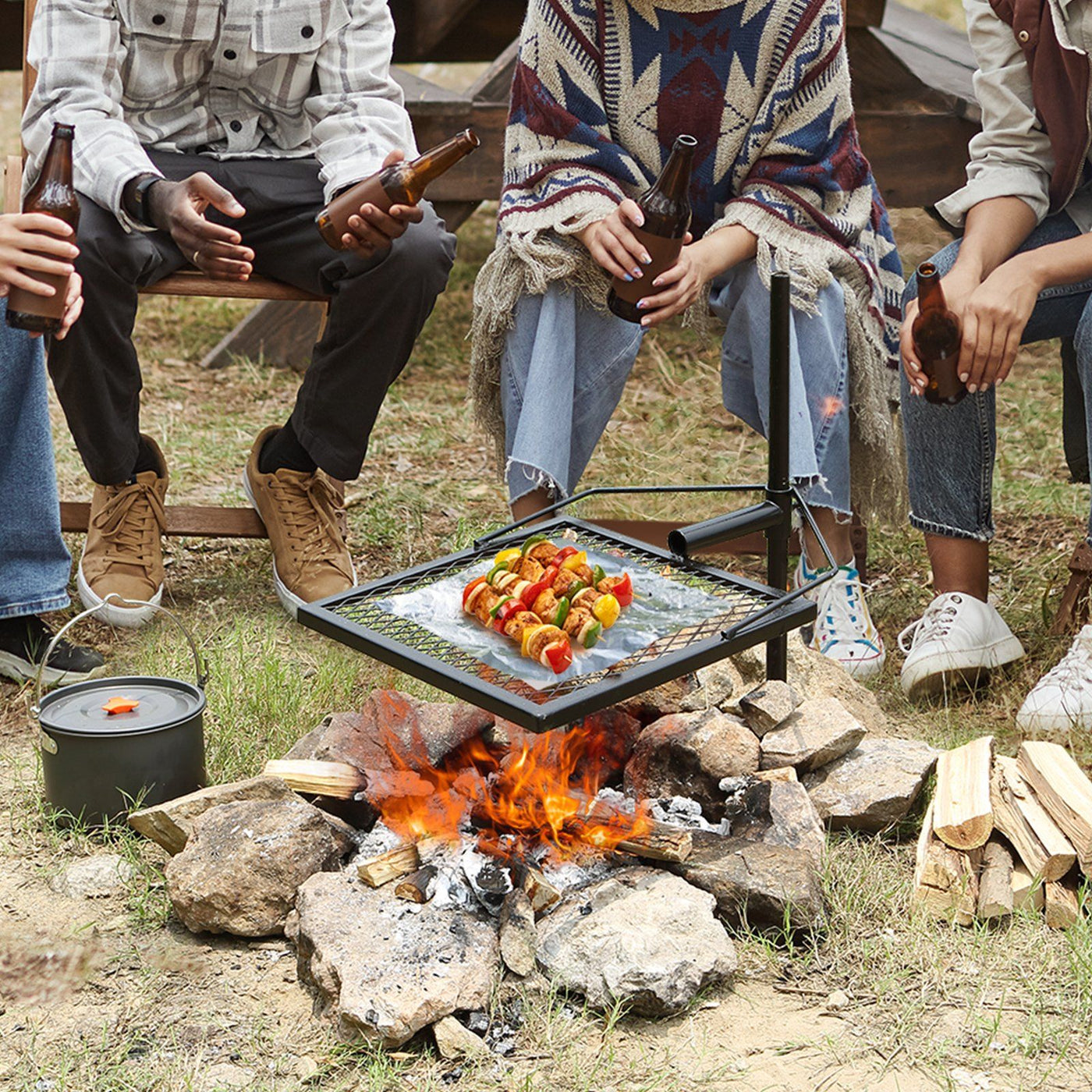 Swivel campfire grill with adjustable steel grate over a fire pit