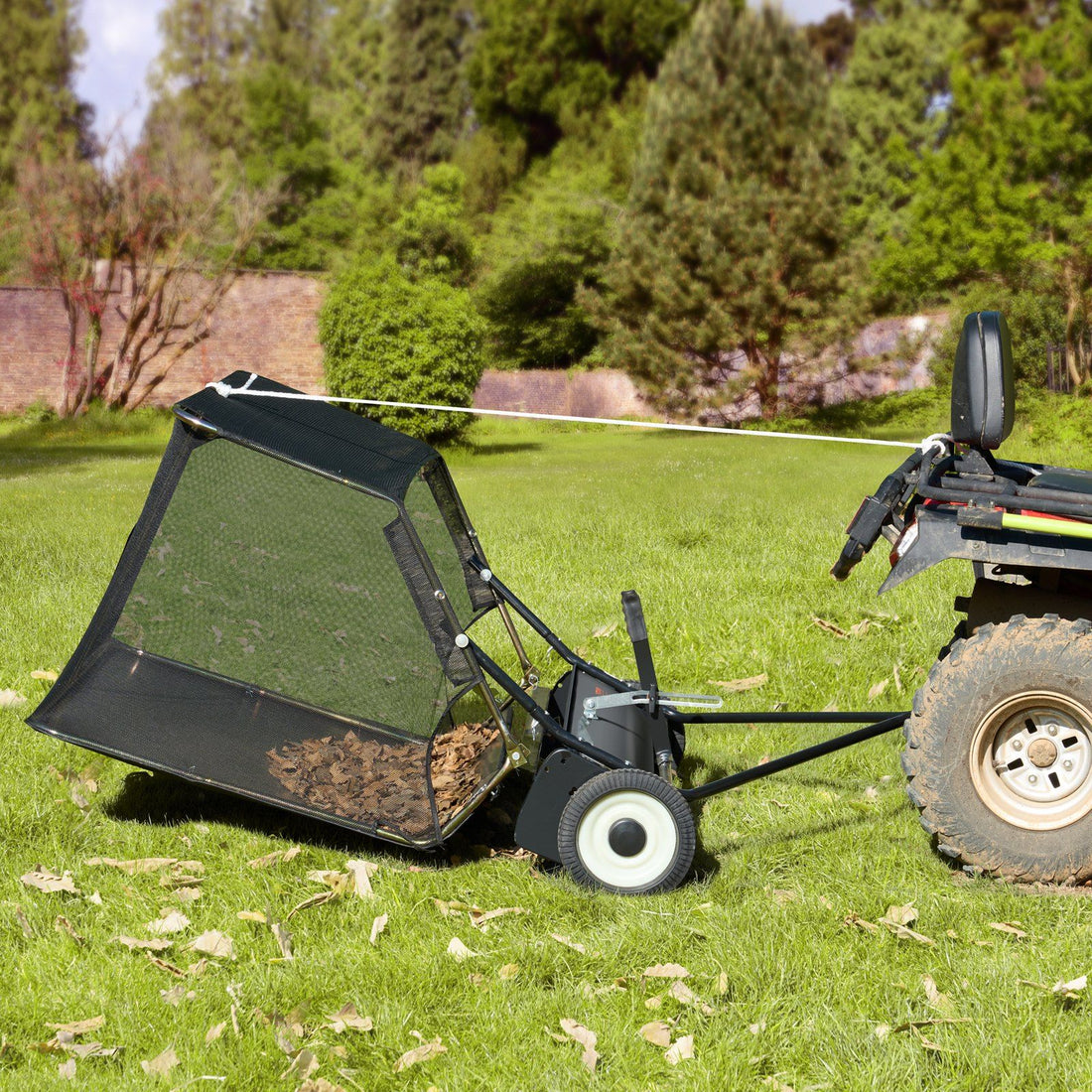 Lawn and leaf collector dumping a full hopper of leaves