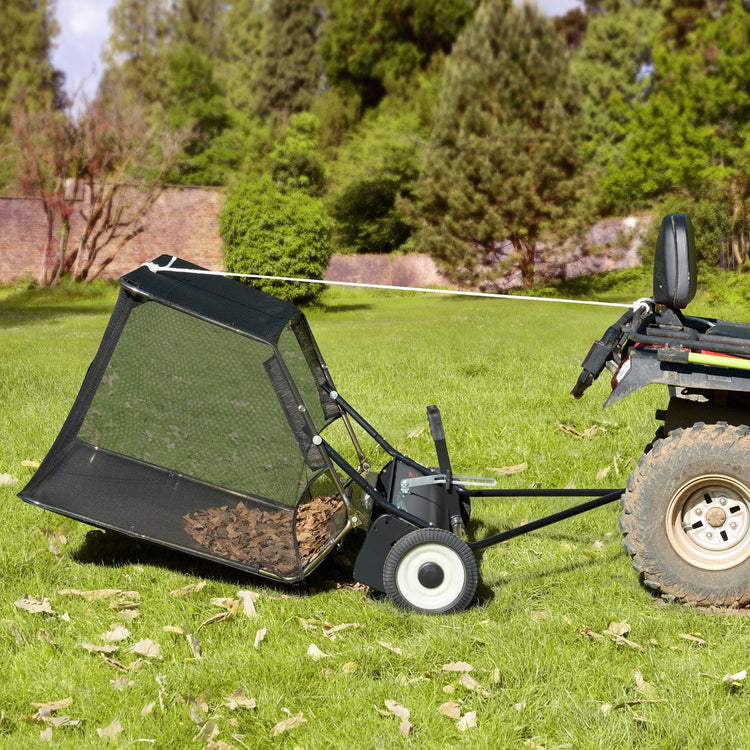 Lawn and leaf collector dumping a full hopper of leaves