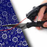 Laser guided scissors projecting a straight cutting line onto paper