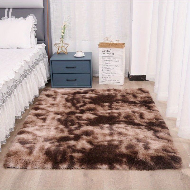 Fluffy tie-dye area rug bedside placement