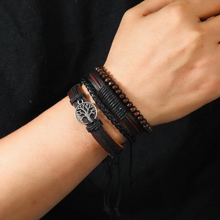 Tree of life charm close-up on multilayer leather bracelet