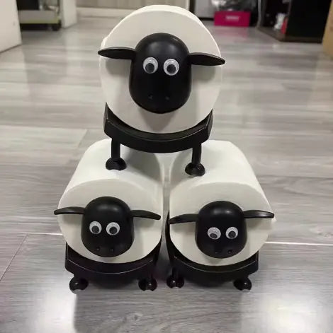 Sheep-face toilet paper roll holder on a bathroom shelf
